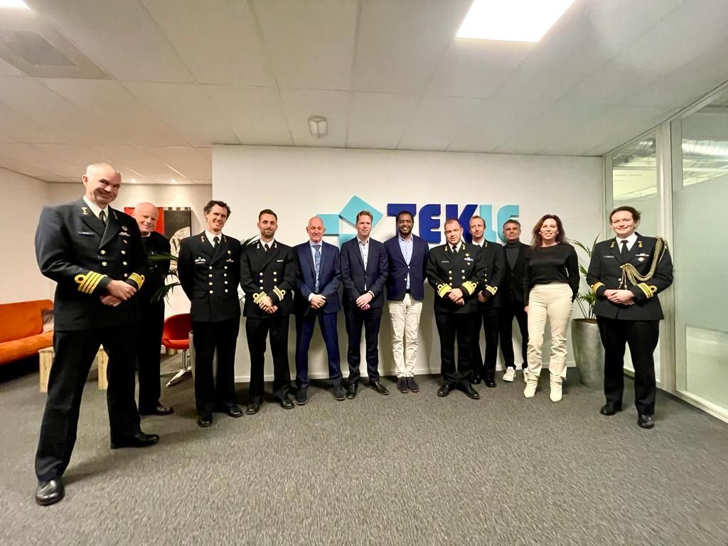 Michel Tzsfaldet with a Royal Netherlands Navy delegation in uniform at the Tekle Holographics offices.